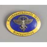 A World War II German Third Reich NSFK oval enamel badge, makers stamp for Ges Gesch.