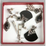 Five pairs of silver and marcasite earrings including onyx examples.