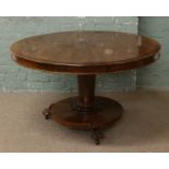 A Victorian mahogany centre pedestal circular tilt top breakfast table.