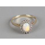 A 9ct gold opal and diamond ring, size O.