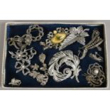 A tray of vintage marcasite jewellery, brooches and clip on earrings.
