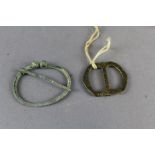 Bronze age buckle from burial mound at Kirkby Stephen & Viking annular brooch