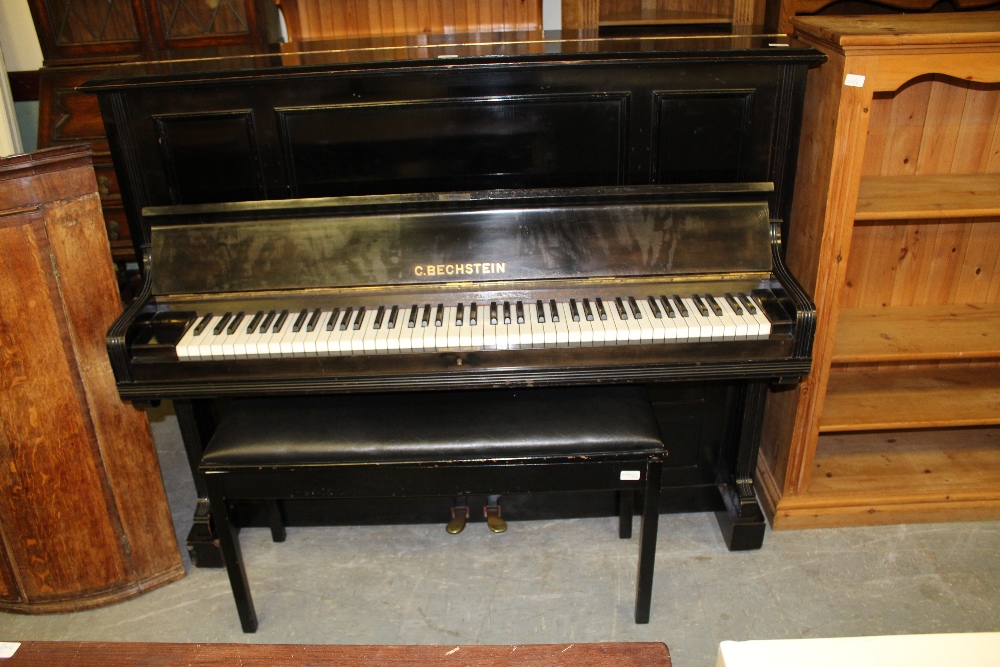 Early 20th Century ebonised upright piano by C. Bechstein, with stool