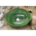 A Schofield Wetheriggs green glazed fruit bowl (chipped)