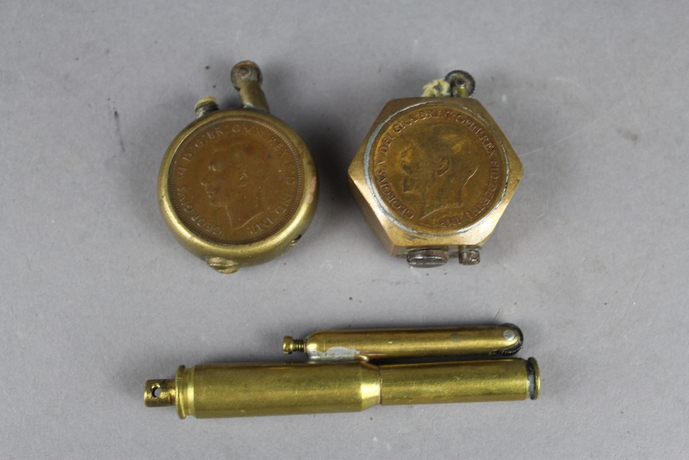 3 Trench Art lighters, two being formed with coins and one of bullet form.