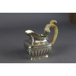 Early 19th Century Russian silver milk jug, with gadrooned body and ivory handle, 11.5cm high,