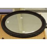 Grained wood oval mirror