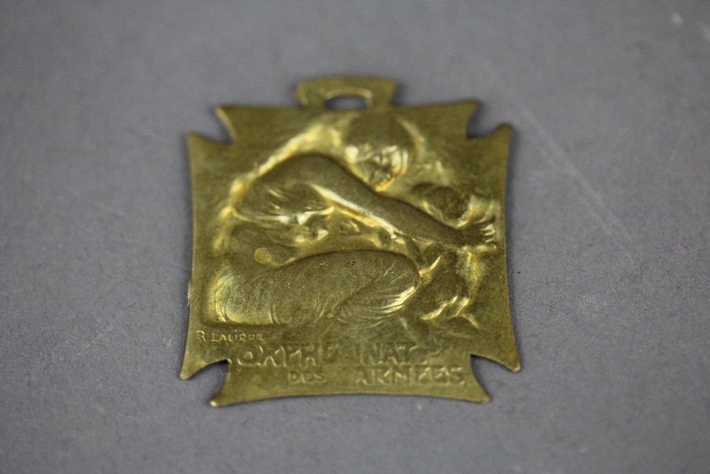 An R. Lalique designed "orphelinat Des Armees" (Orphanage of the War) medallion.