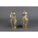 Pair of Chinese famille rose vases with covers