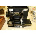 Singer sewing machine model 221k cased with attachments