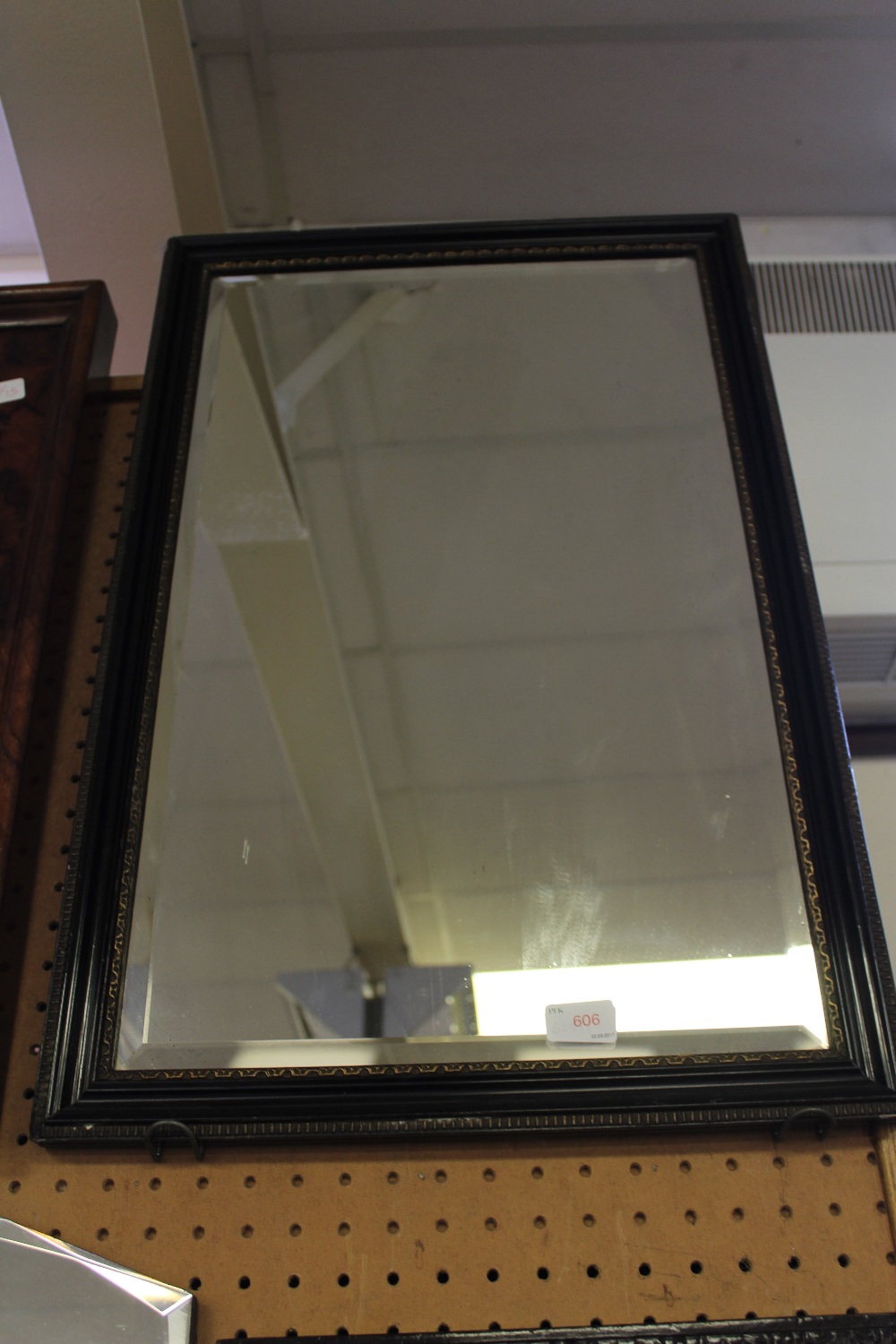 Bevelled mirror with Hogarth type frame