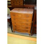 Walnut serpentine fronted chest of 5 drawers
