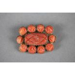 Coral & Yellow metal brooch