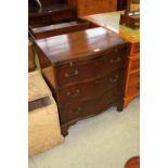 Serpentine fronted chest of drawers with slide
