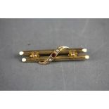 9ct gold bar brooch set with red stones and seed pearls