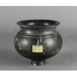 A Roman black pottery footed bowl, 14cm diameter x 12cm high, with old exhibition label stating