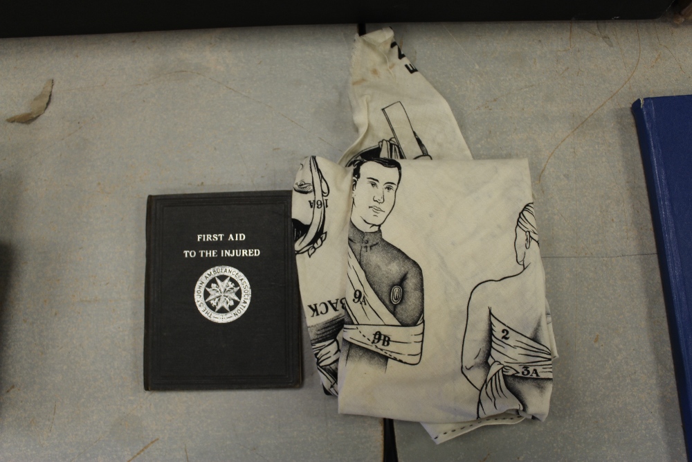 Old 'First Aid' book and pictorial bandage