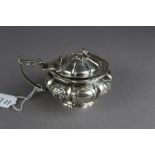 William IV silver mustard pot, lobed sides with cast floral cartouches, date letter rubbed, weight