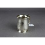 An early 20th Century silver Christening mug, 7cm high Birmingham assay mark, date letter rubbed,