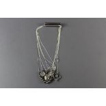 Seven assorted silver pendants & chains