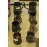 8 pewter tankards, 2 stamped "VR"