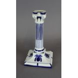 A Royal Worcester blue and white porcelain candlestick of Corinithian design, 21cm high, impressed