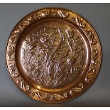 A Keswick School of Industrial Arts copper circular plaque by A. Hogarth, embossed with repeating