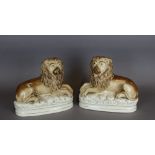 A pair of late 19th Century Staffordshire-type pottery figures of lions, 24cm high Good overall,