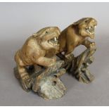 A pair of carved and painted wood figures of tigers, 17cm high Wear to backs, lacking eyes