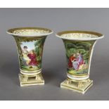 A pair of mid 19th Century English porcelain vases with flared rims, painted with lovers in