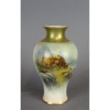 A Royal Worcester porcelain baluster shaped vase with flared rim and foot, decorated with Highland