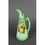 A Royal Worcester porcelain miniature ewer, painted with fruit and flowers by F. Parker within green