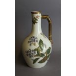 A Royal Worcester porcelain pitcher, decorated in colours and gilt with floral sprays and