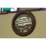 Seven gilt framed convex mirrors