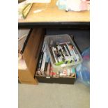 Box of sporting themed books and box of games