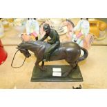 Resin model of a horse and rider