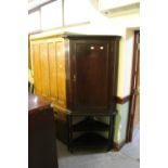 Mahogany corner cupboard on stand