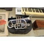 An early 20th Century T. Woods silver plated cornet marked with address 22 Collingwood Street,