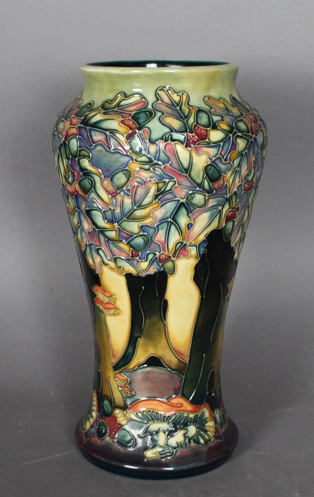 A modern Moorcroft tube lined pottery 'Knightwood' vase, 27cm high, dated '97 with initials SG, in