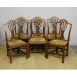 A good set of six 18th Century elm dining chairs of Provincial Hepplewhite design, with drop-in rush