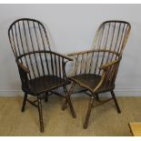 Two 18th Century elm two tier stick back Windsor armchairs of similar design, with shaped seats