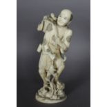 An early 20th Century Japanese carved ivory figure of a standing fish seller, with basket of fish to