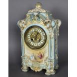 A late 19th/early 20th Century French blue glazed and gilded pottery case mantle clock, the