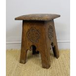 An oak and studded leather topped stool of Arts & Crafts Liberty design, the seat embossed with