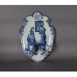 A late 19th Century Joost Thooft & Labouchere Delft blue and white pottery girandole, painted with