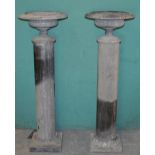 A pair of Edwardian polished granite shallow urns on pedestals, 44cm diameter x 135cm high, Small