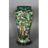 A modern Moorcroft tube lined pottery vase - Woodland scene, 17cm high, dated '97 with initials
