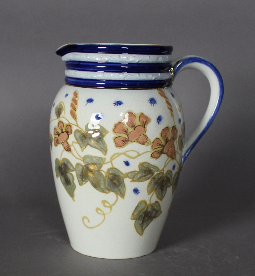 An early 20th Century Macintyre Moorcroft pottery jug, decorated with wisteria, 17cm high, impressed