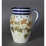 An early 20th Century Macintyre Moorcroft pottery jug, decorated with wisteria, 17cm high, impressed