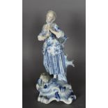 A late 19th/early 20th Century Meissen porcelain figure of a Shepherdess, 26cm high, underglaze blue